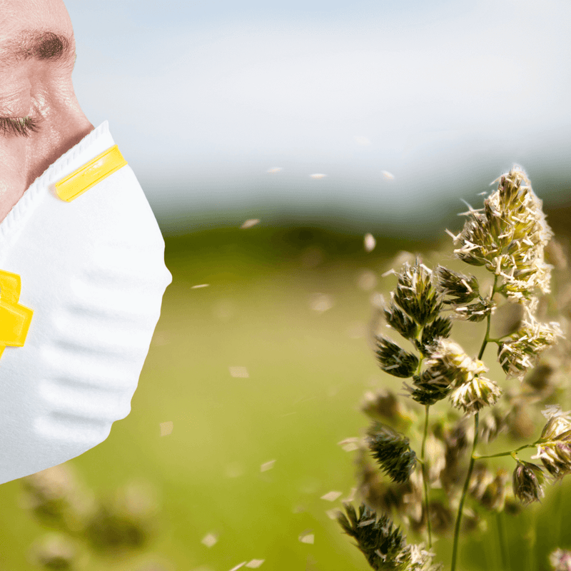 Close-up of a person wearing a mask outdoors, demonstrating how Manuka Honey helps with seasonal allergies.