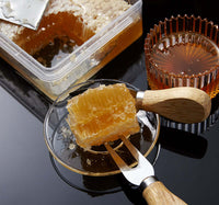 The Morning Ritual Pair | Manuka & Honeycomb Duo showcasing honeycomb with serving tools and honey in glass dishes.