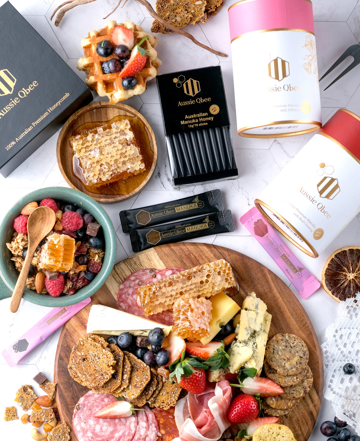 Assorted food items and Aussie Cheese products on a white surface