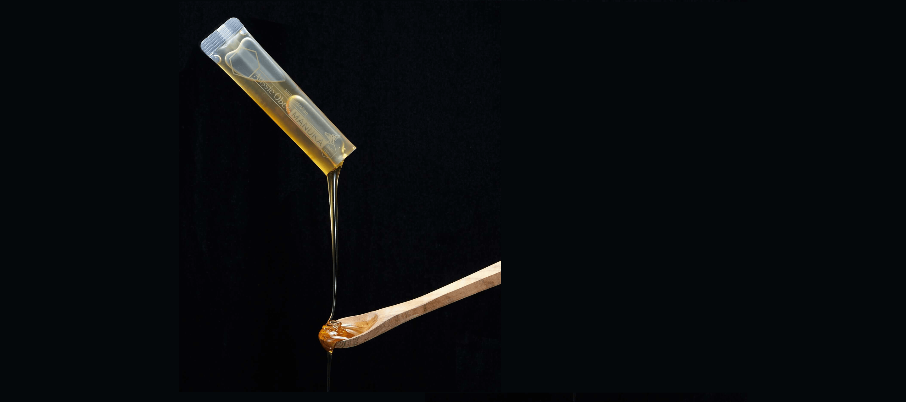 Butter stick with a drizzle of butter on a black background